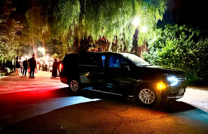 Black GMC Yukon Denali on an evening run